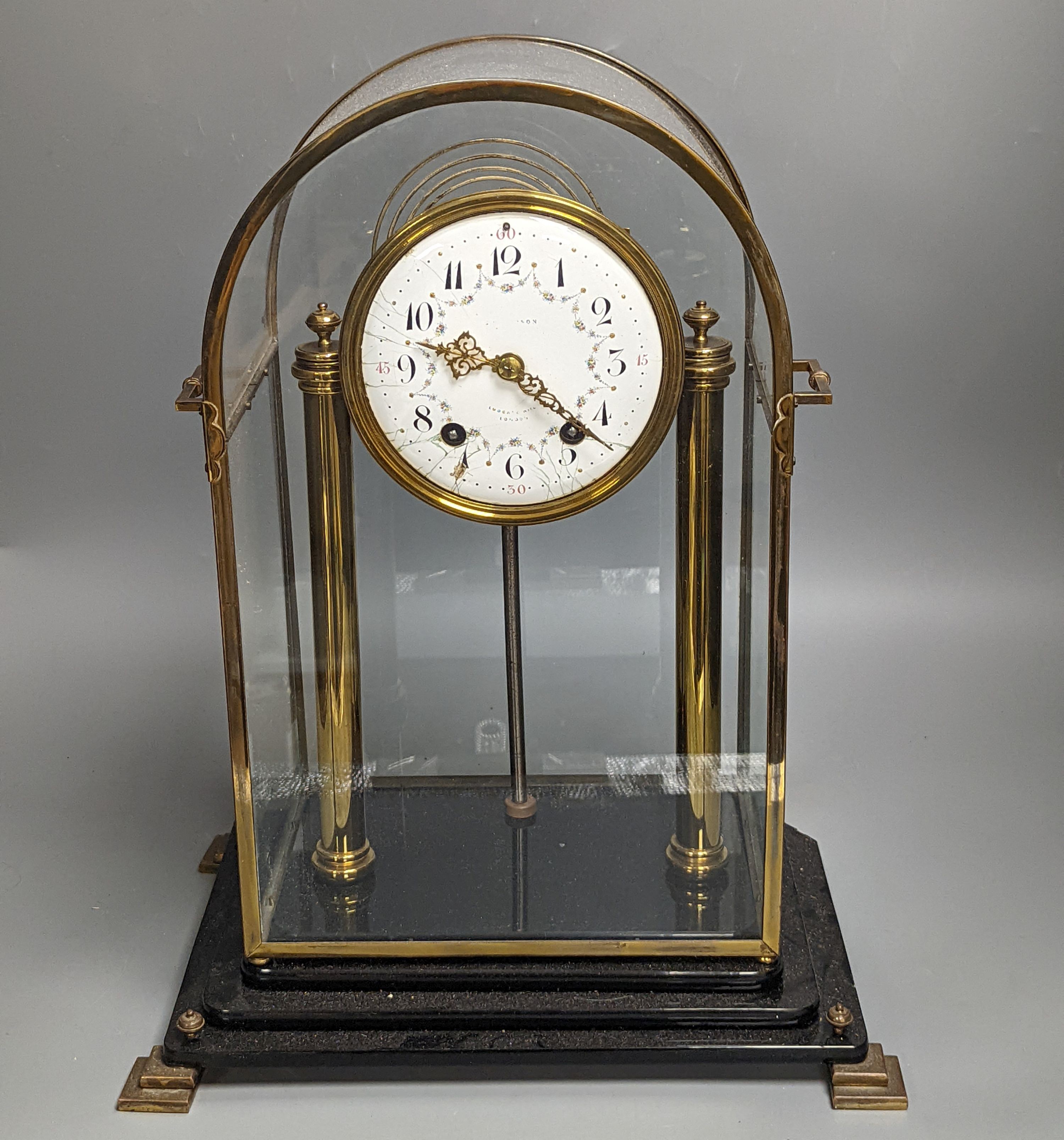 A large four glass clock, with decorative enamel dial, 43.5 cms high.